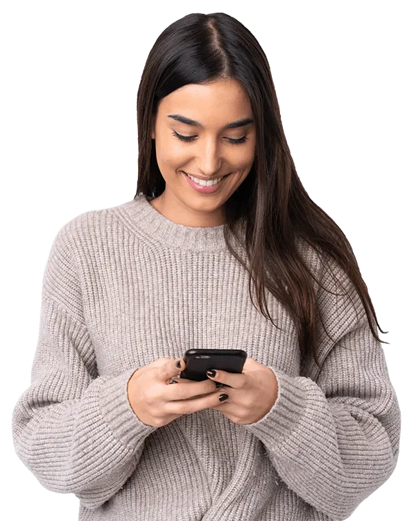 Smiling woman using phone